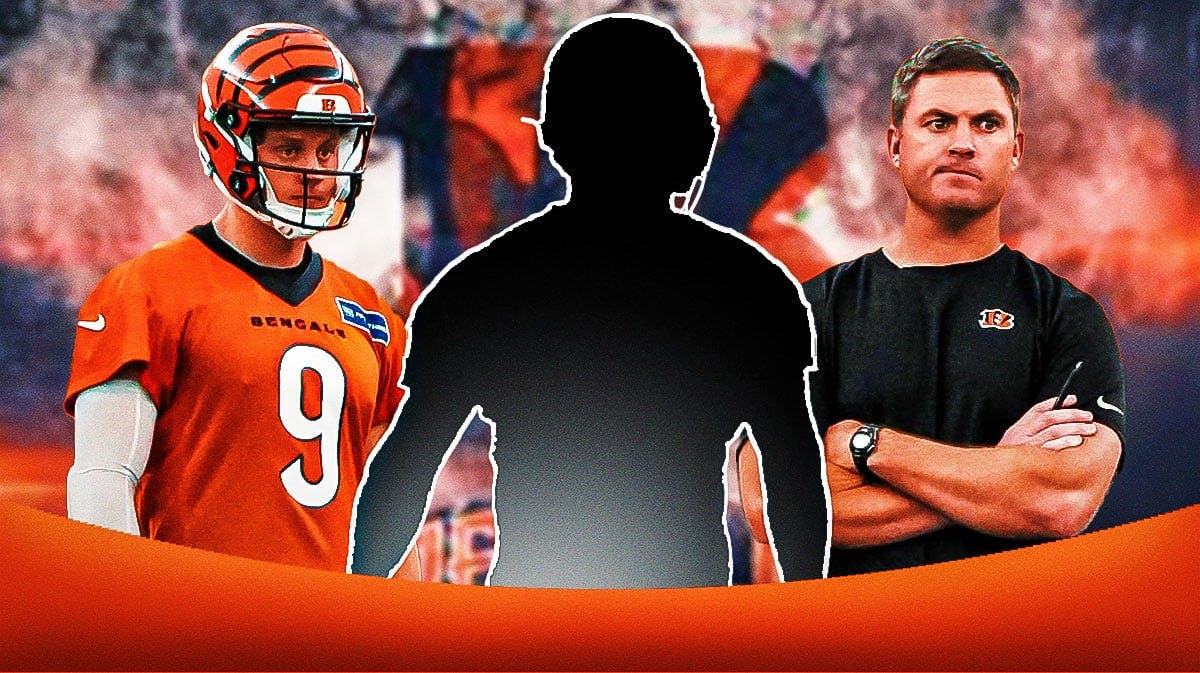 1 Mystery player in the middle, Chase Brown and coach Zac Taylor around him, Cincinnati Bengals wallpaper in the background
