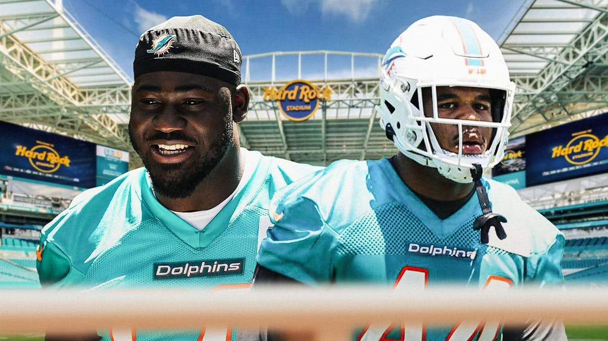 Chop Robinson and Mo Kamara in front of the Dolphins stadium