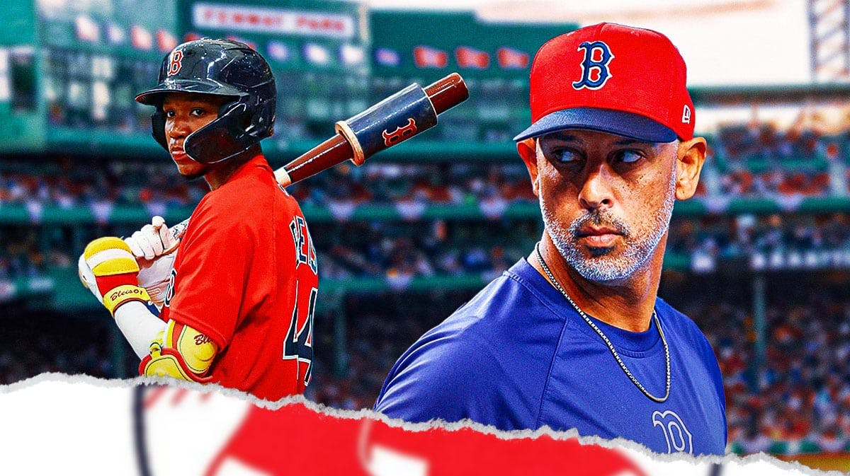 Red Sox manager Alex Cora looking and Miguel Bleis