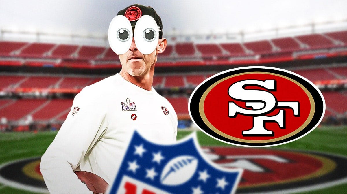 49ers Kyle Shanahan with emoji eyes in his eyes looking at a 49ers logo
