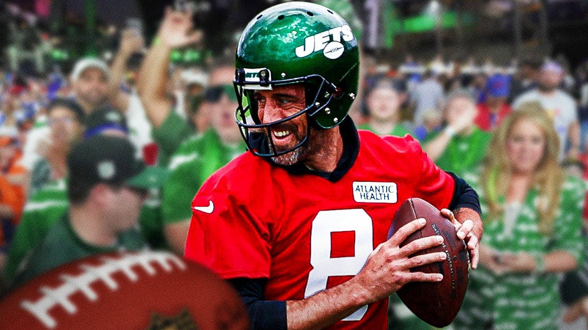 Photo: Aaron Rodgers laughing in Jets jersey, Jets fans in background
