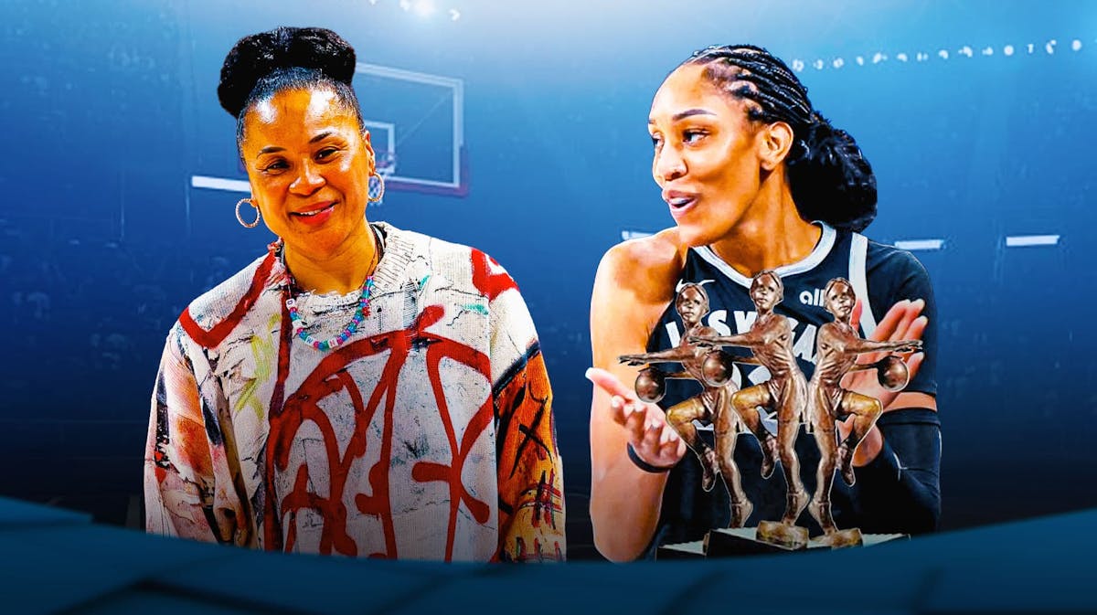 Dawn Staley smiling at A'ja Wilson, with the WNBA MVP trophies near Wilson