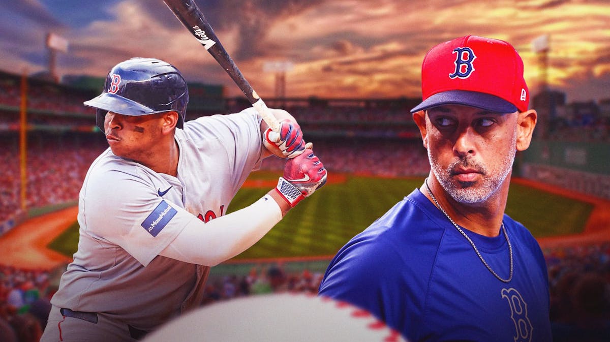 Red Sox Rafael Devers and Alex Cora. Fenway Park background