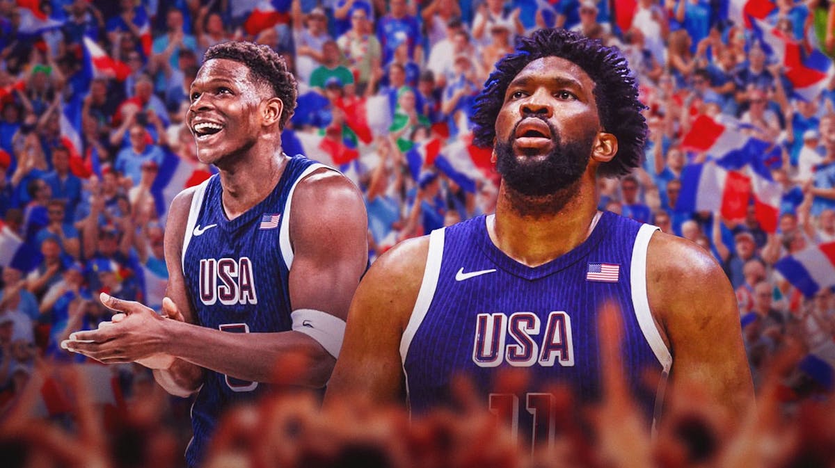 Anthony Edwards smiling with Joel Embiid wearing Team USA uniforms French fans in the background.