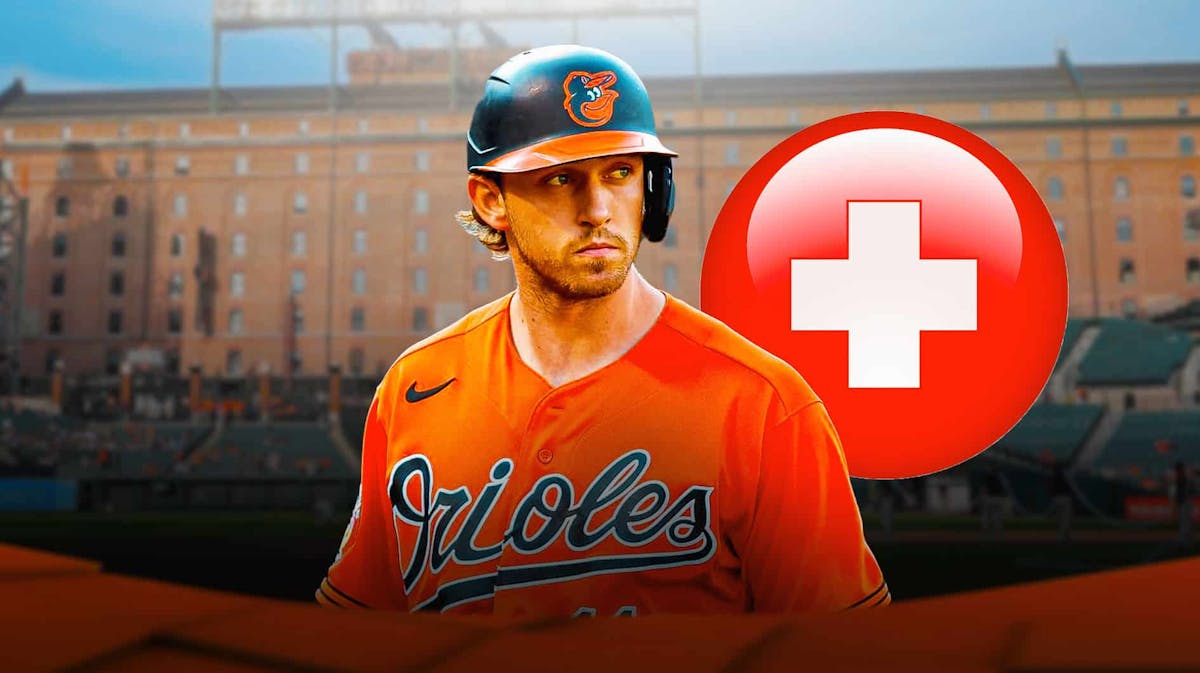 Jordan Westburg in a Baltimore Orioles uniform looking frustrated with a red and white first aid symbol next to him indicating that Westburg has been injured and the Orioles don't know when he'll be back from the injured list just after the trade deadline.