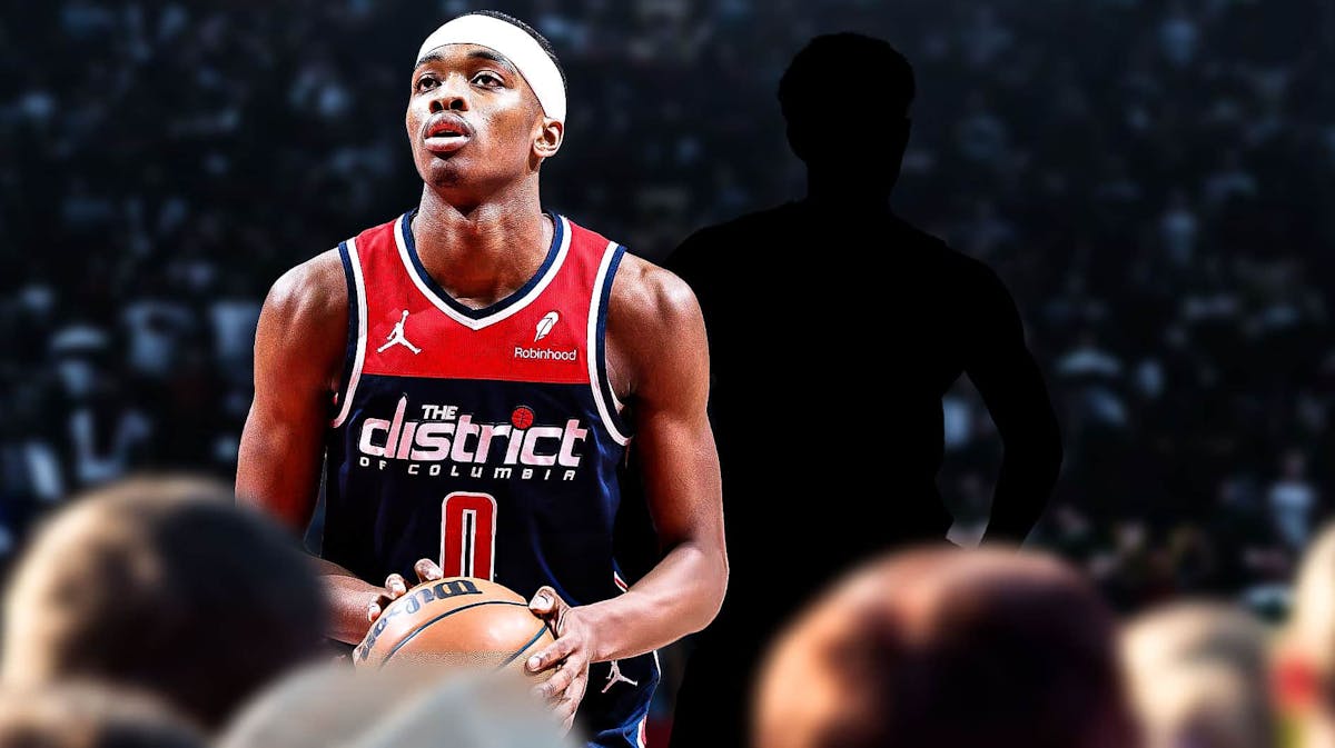 Bilal Coulibaly next to the blacked-out silhouette of Tyus Jones in the Wizards Arena.