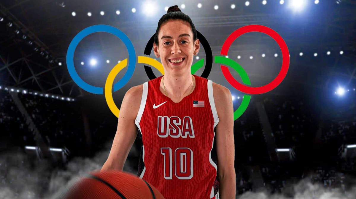 Breanna Stewart in her Team USA basketball jersey with the Olympics logo in the background, Liberty