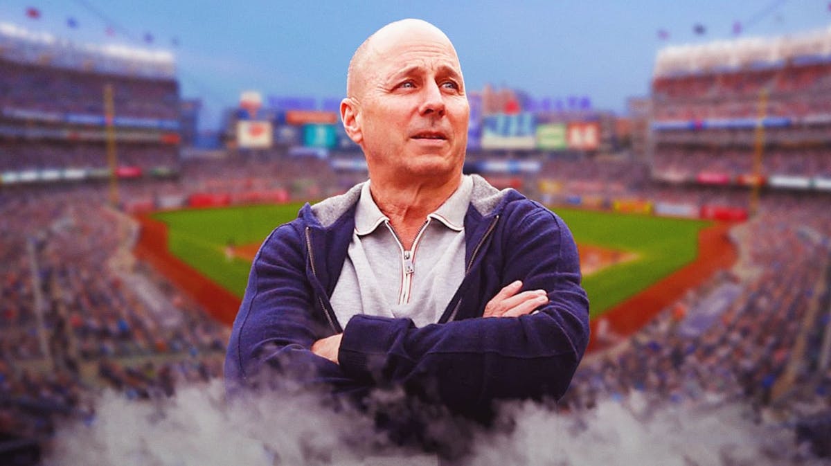 Yankees general manager Brian Cashman appears frustrated with Yankee Stadium in the background