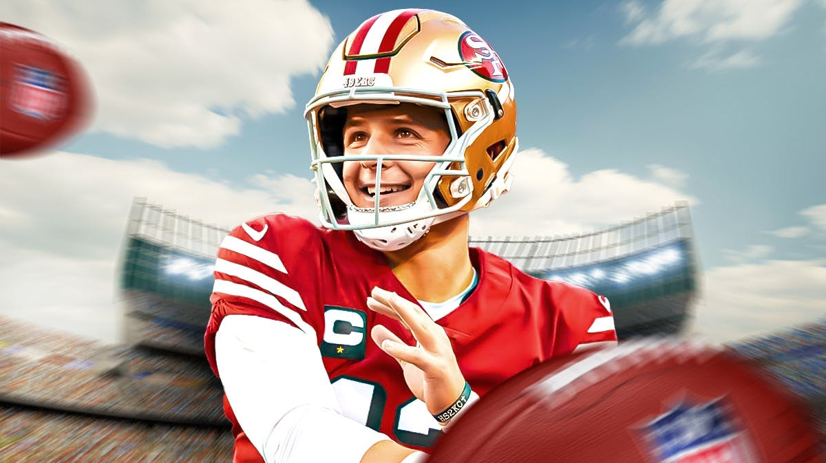 Brock Purdy with a huge smile in a 49ers jersey