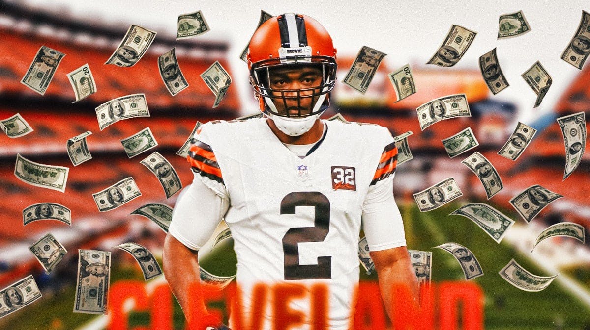Browns' Amari Cooper with contract money flying around, Cowboys fans in background