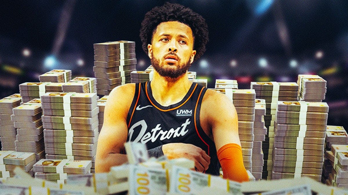Cade Cunningham surrounded by piles of cash.