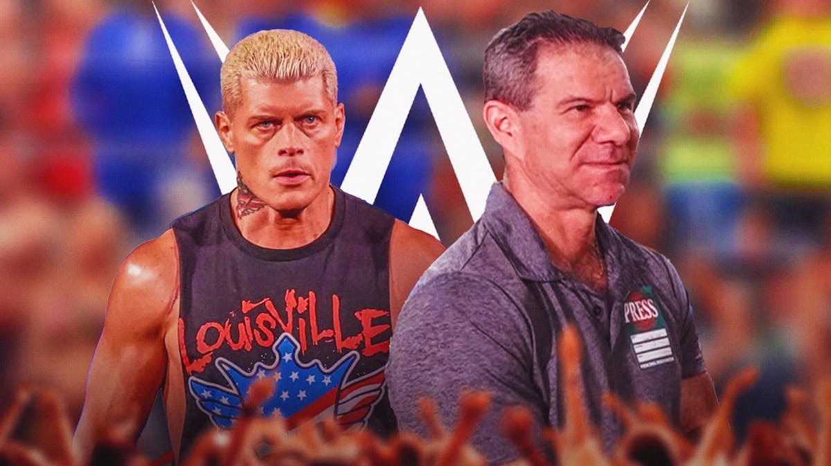 Wrestling journalist Dave Meltzer next to Cody Rhodes with the WWE logo as the background.