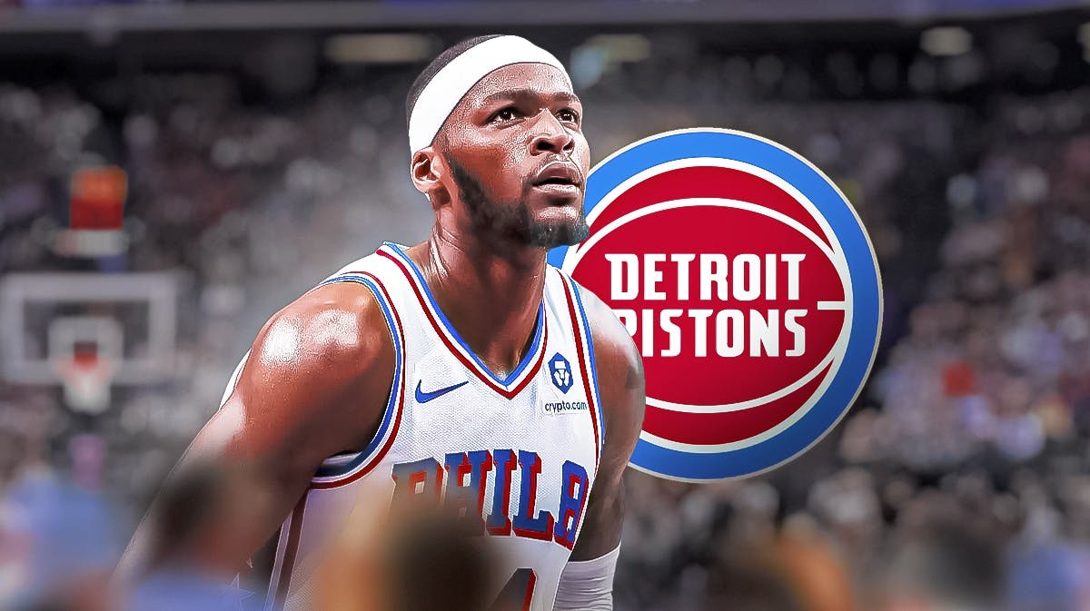 Paul Reed stands beside Pistons' log after free agency move, Joel Embiid in background