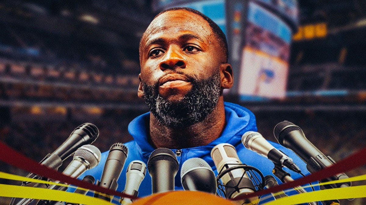Draymond Green holds a microphone
