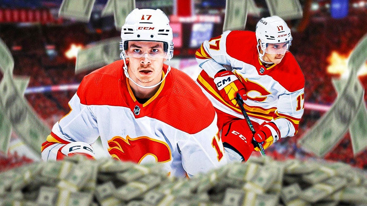 Photo: Yegor Sharangovich in Flames jersey with money flying around him