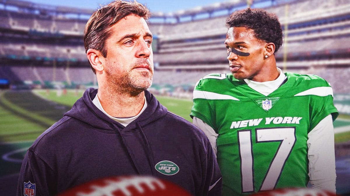 Garrett Wilson and Aaron Rodgers look mad at each other in Jets jerseys