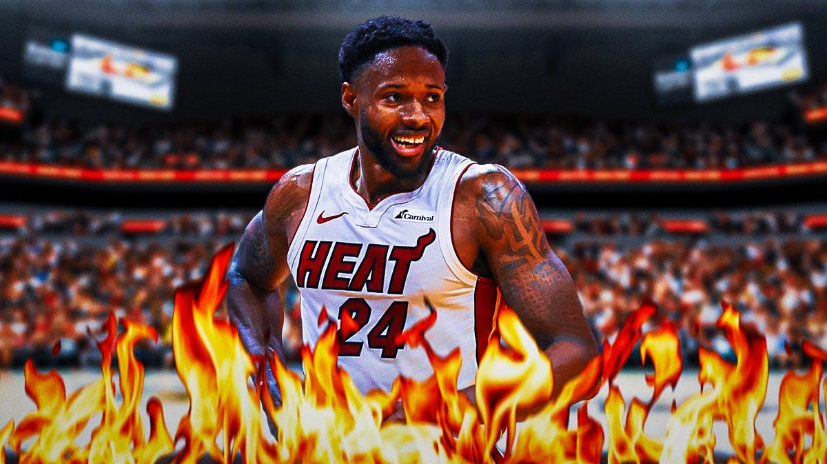 Miami Heat star Haywood Highsmith in front of Kaseya Center with fire around him.