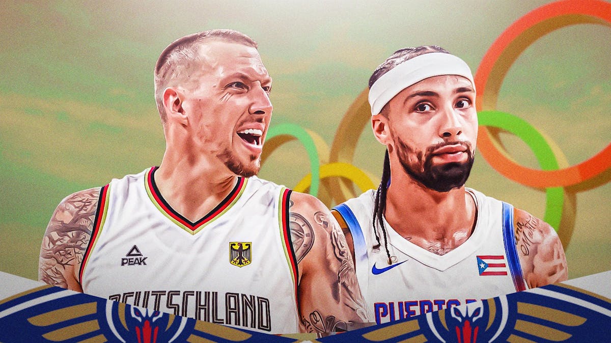 Pelicans' Jose Alvarado and Daniel Theis with the Olympics backdrop.