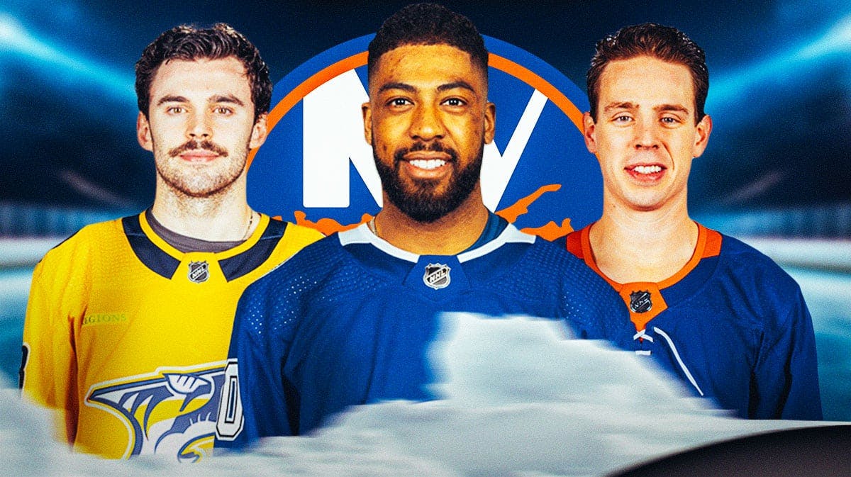 Anthony Duclair in middle, Liam Foudy and Mike Reilly on either side, New York Islanders logo, hockey rink in background