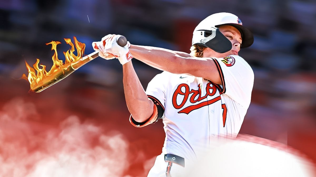 Orioles Jackson Holliday with fire coming off bat hitting a baseball.