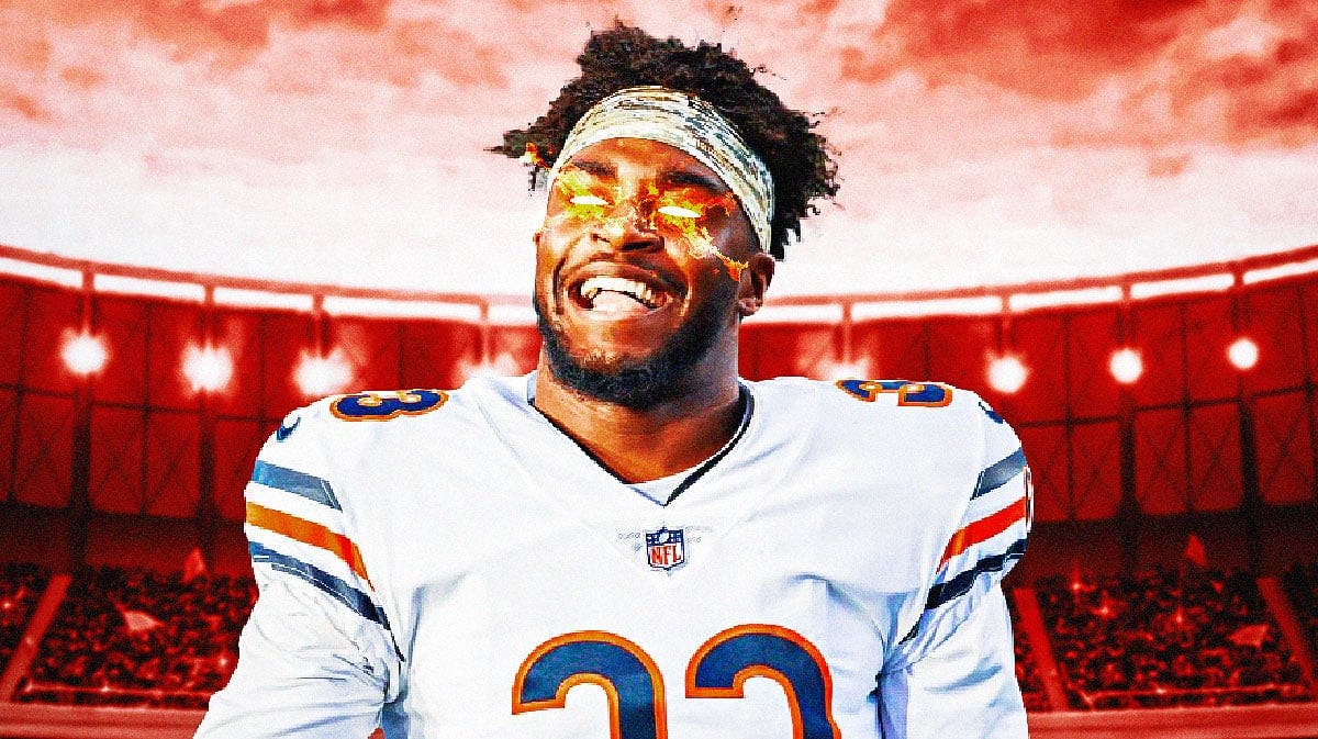 Jaylon Johnson with fire in his eyes with a Chicago Bears colored background