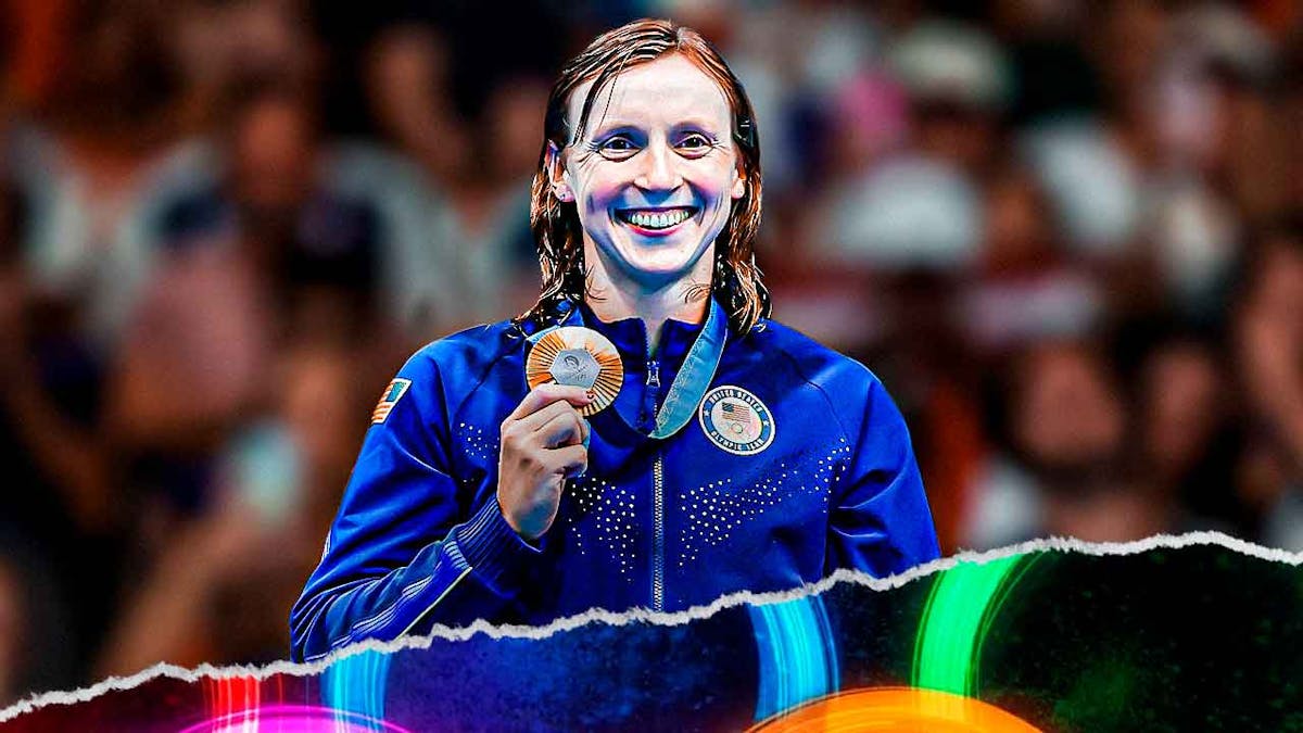 Katie Ledecky smiles with Gold medals around her neck