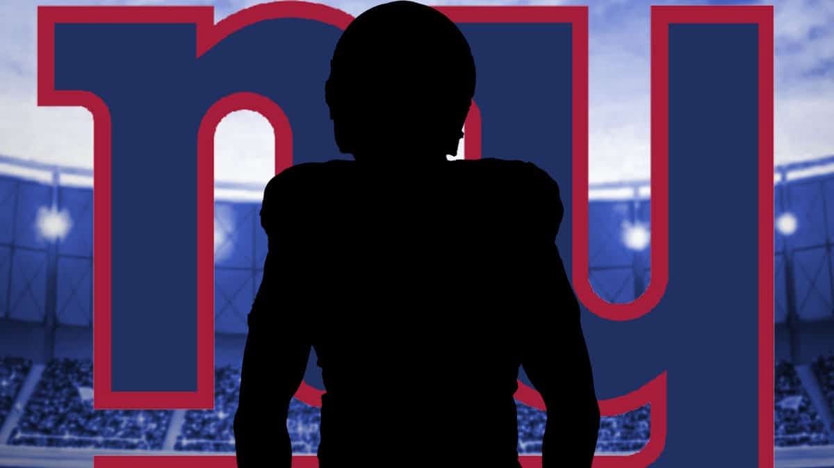 Silhouetted Raiders Player with a New York Giants background.