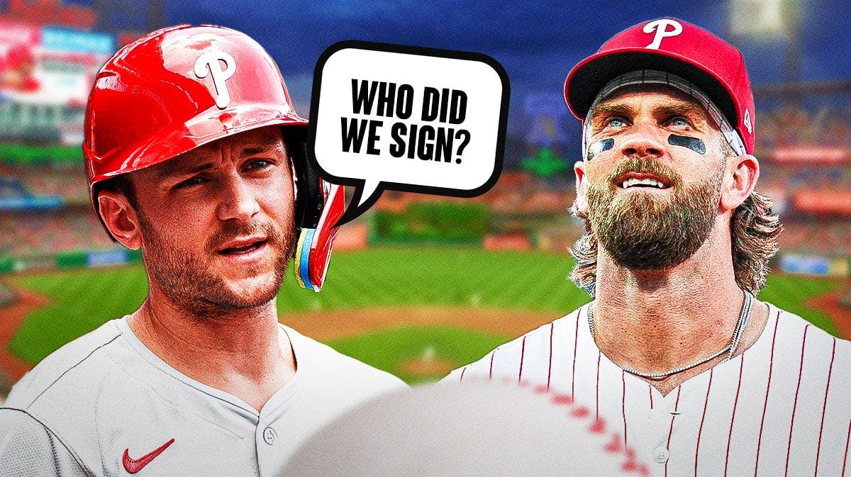 Phillies Trea Turner asking Phillies Bryce Harper the following question: Who did we sign? Place Citizens Bank Park in background.