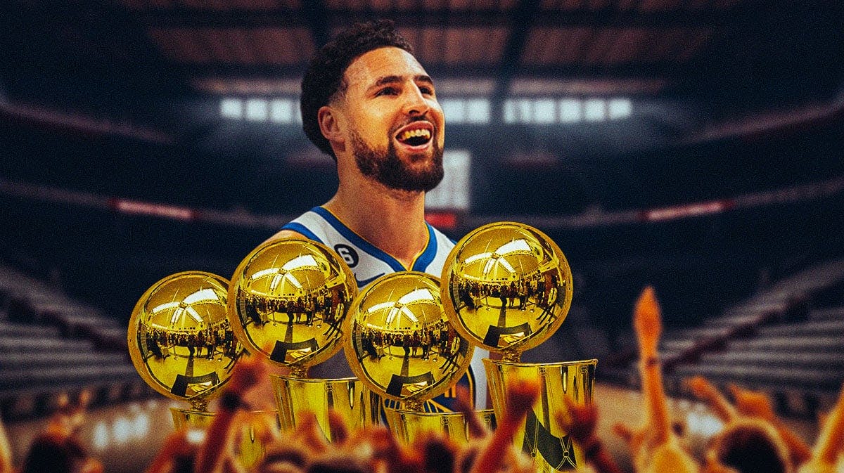 Klay Thompson with four NBA Finals trophies.