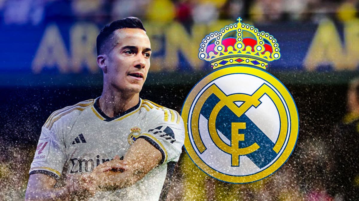 Lucas Vazquez in front of the Real madrid logo
