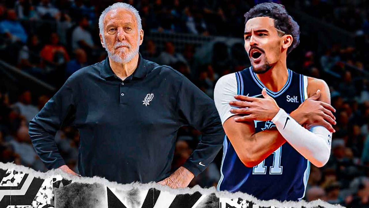 Gregg Popovich next to Trae Young wearing a Spurs jersey