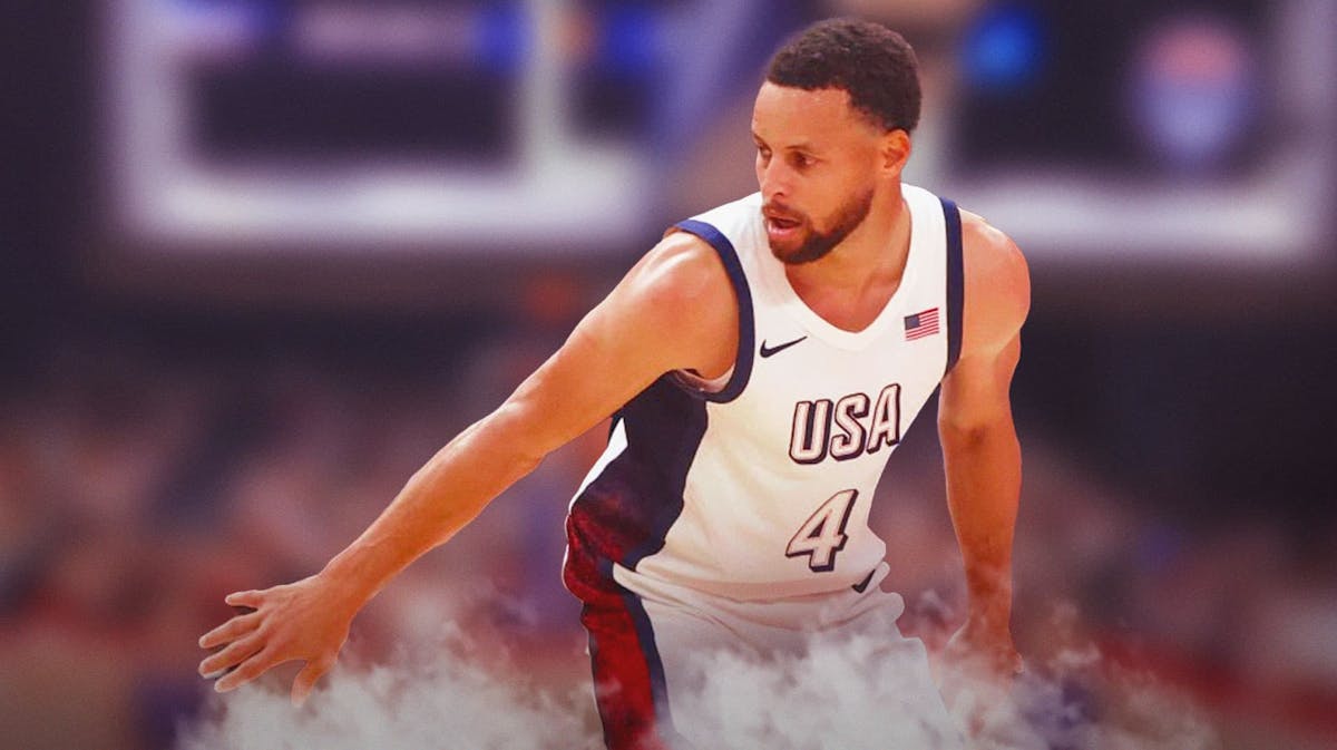 Stephen Curry wearing Team USA gear playing defense.