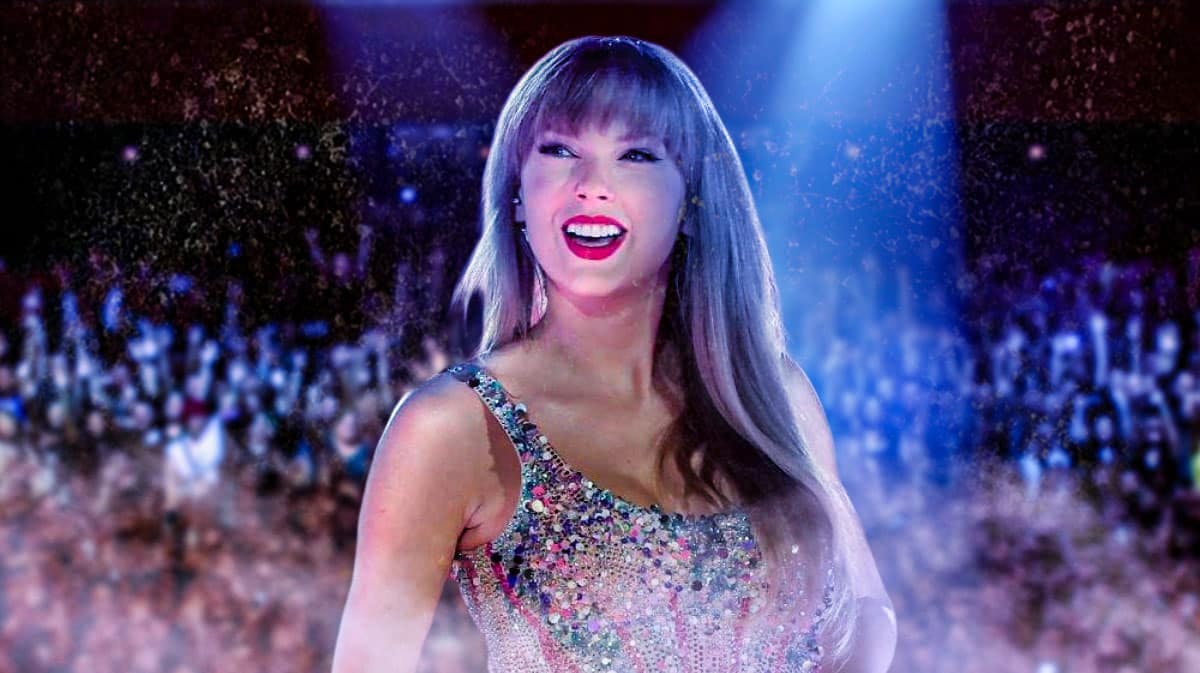 Taylor Swift on the Eras Tour with concert crowd background.