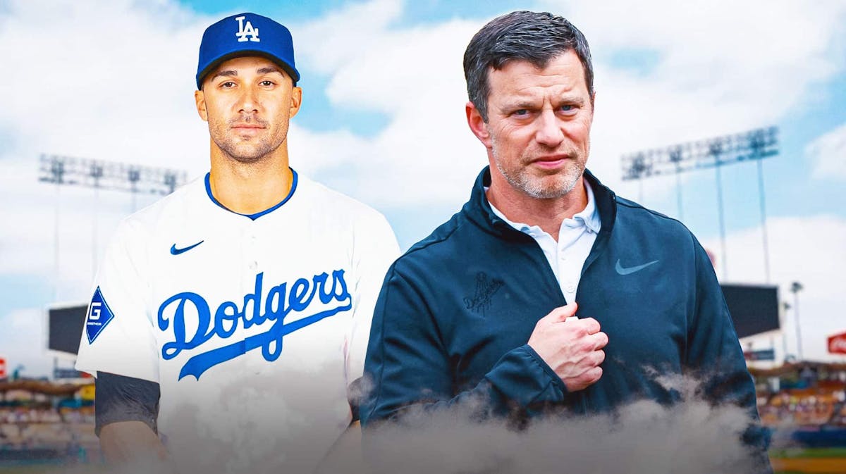 Jack Flaherty in a dodgers jersey and andrew friedman in front of Dodgers logo
