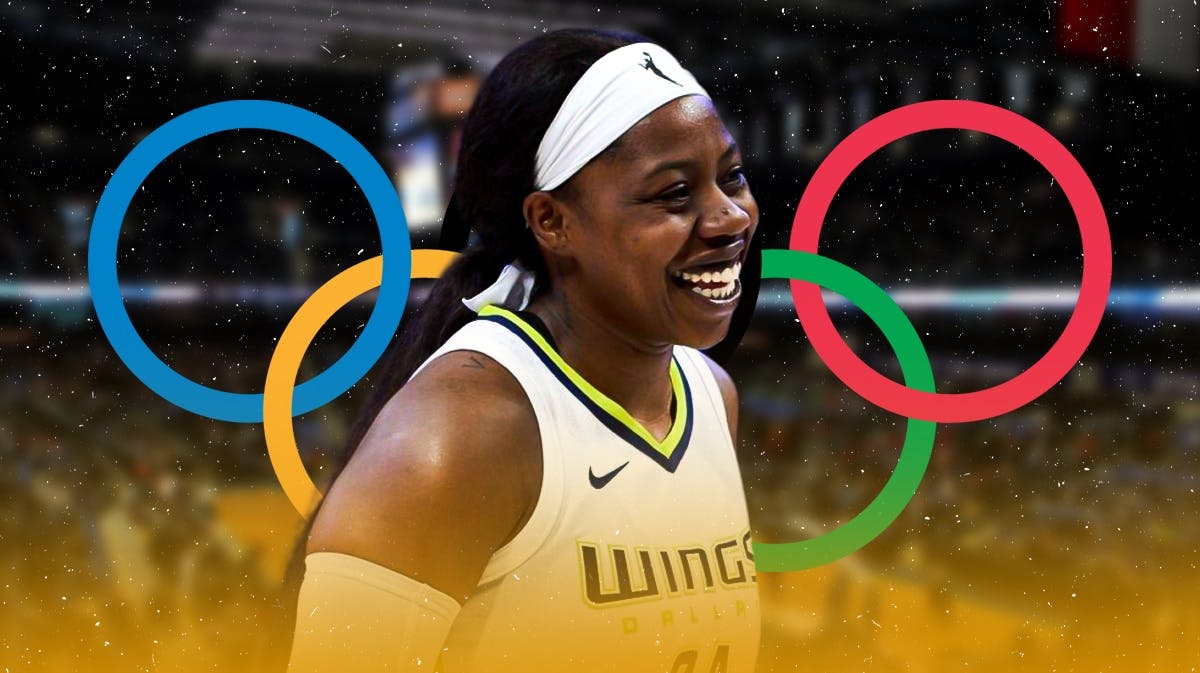 Dallas Wings player Arike Ogunbowale, with the Olympic rings behind her