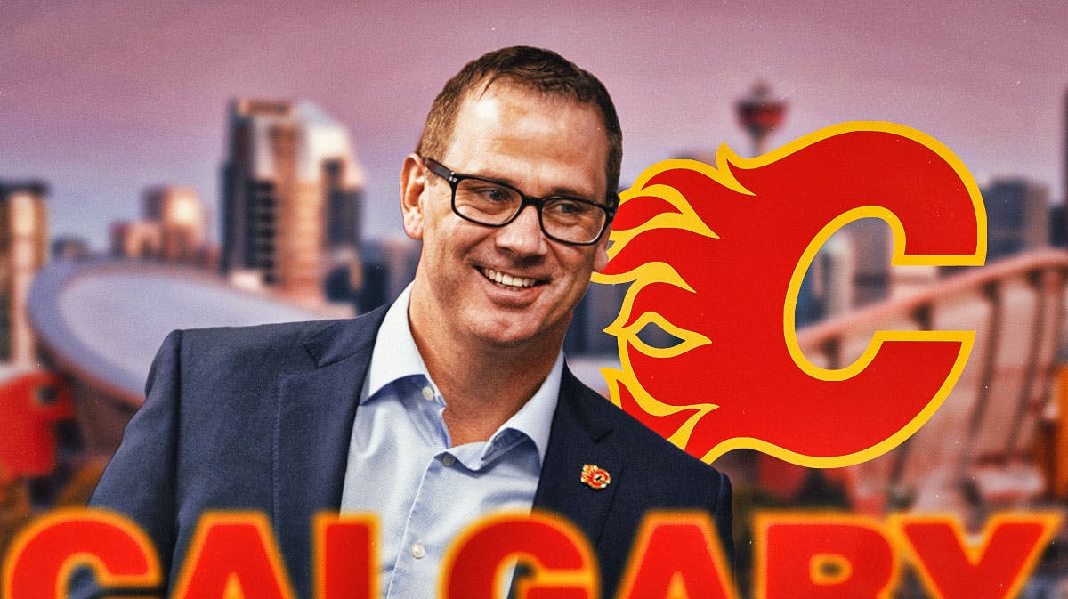Craig Conroy and Flames logo in front of the Saddledome