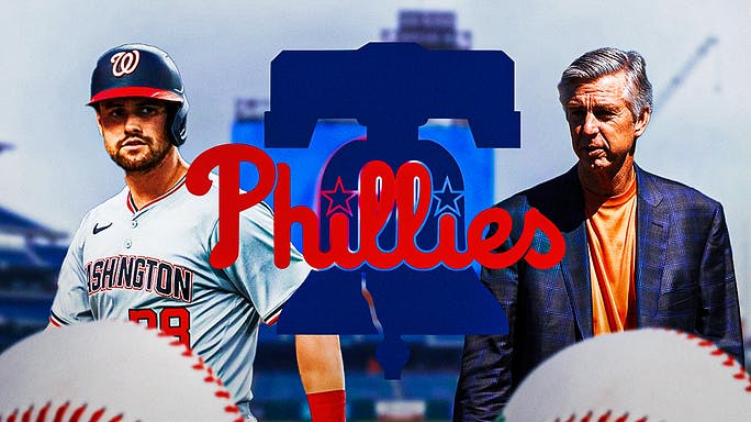 Phillies general manager Dave Dombrowski smiling next to Phillies logo in the middle. Lane Thomas