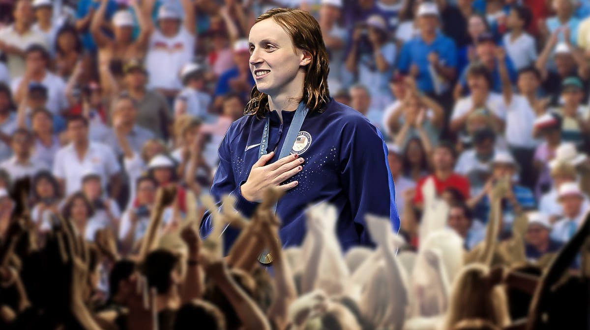 Olympic swimmer Katie Ledecky with the gold medal in front of the Paris crowd.