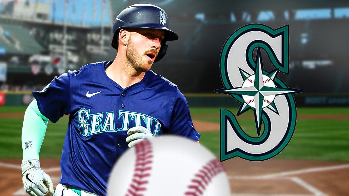 Mitch Garver in front of Mariners logo