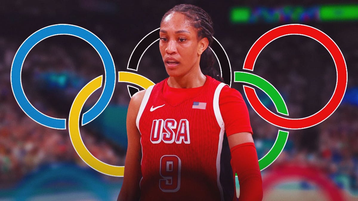 A'ja Wilson in her Team USA basketball jersey with the Olympics logo in the background, Aces