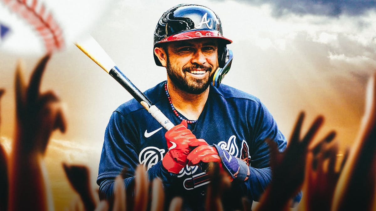 Travis d'Arnaud holding a bat under rays of golden light