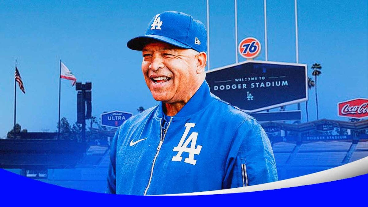 Dave Roberts smiles in Dodgers gear