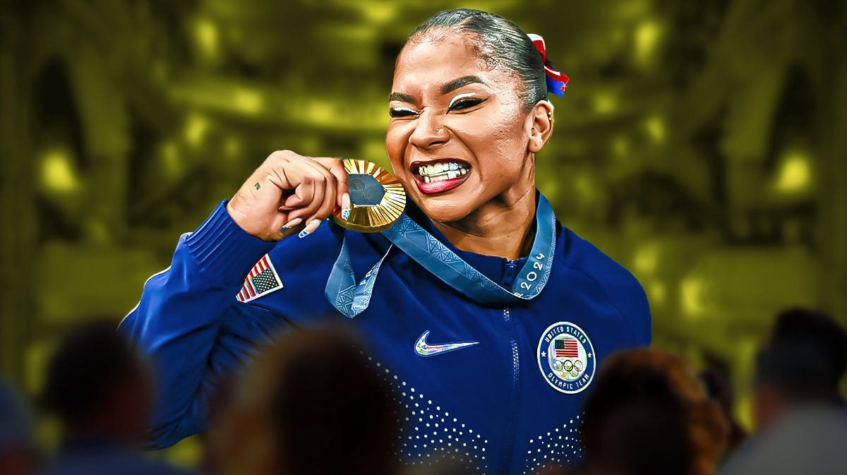 Jordan Chiles biting her gold medal