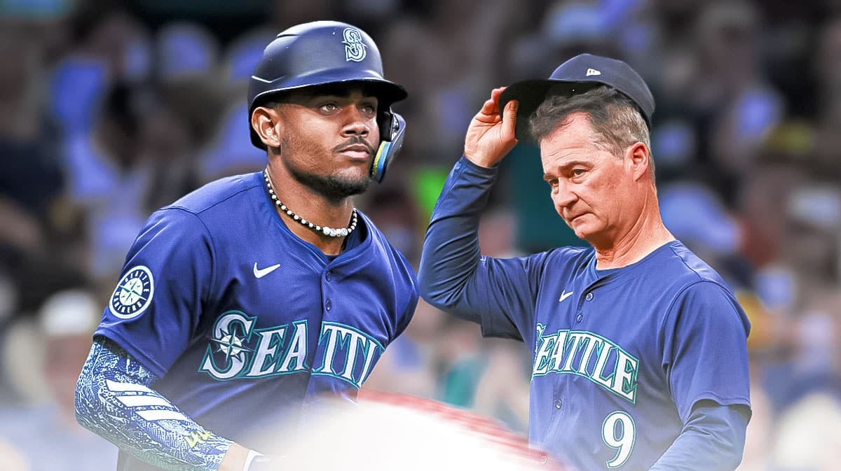 Mariners manager Scott Servais looking at outfielder Julio Rodriguez.