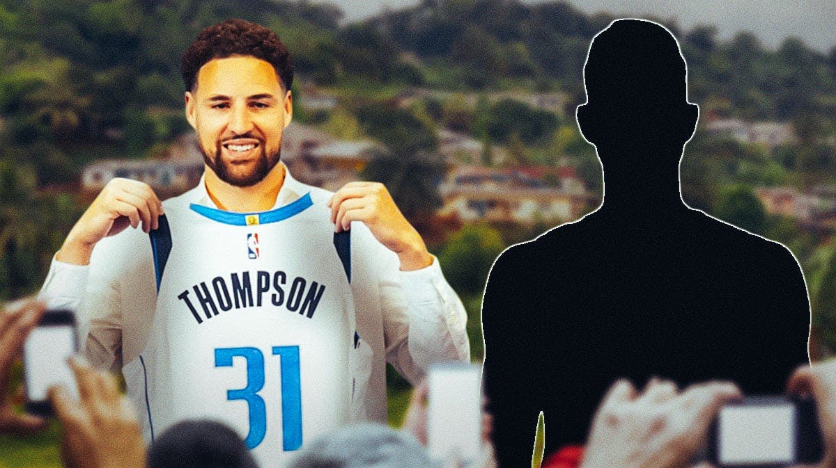 Klay Thompson with a Mavericks jersey on with mystery player standing next to him with Cameroon in the background.