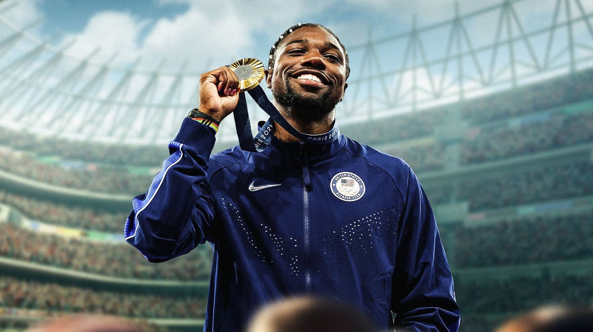 Team USA's Noah Lyles smiling while wearing his gold medal