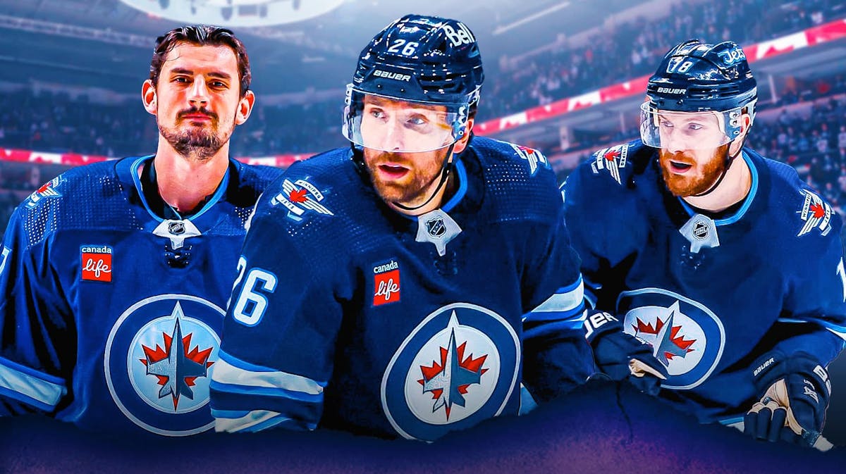 Blake Wheeler, Ilya Kovalchuk, and Connor Hellebuyck in front of Winnipeg Jets logo