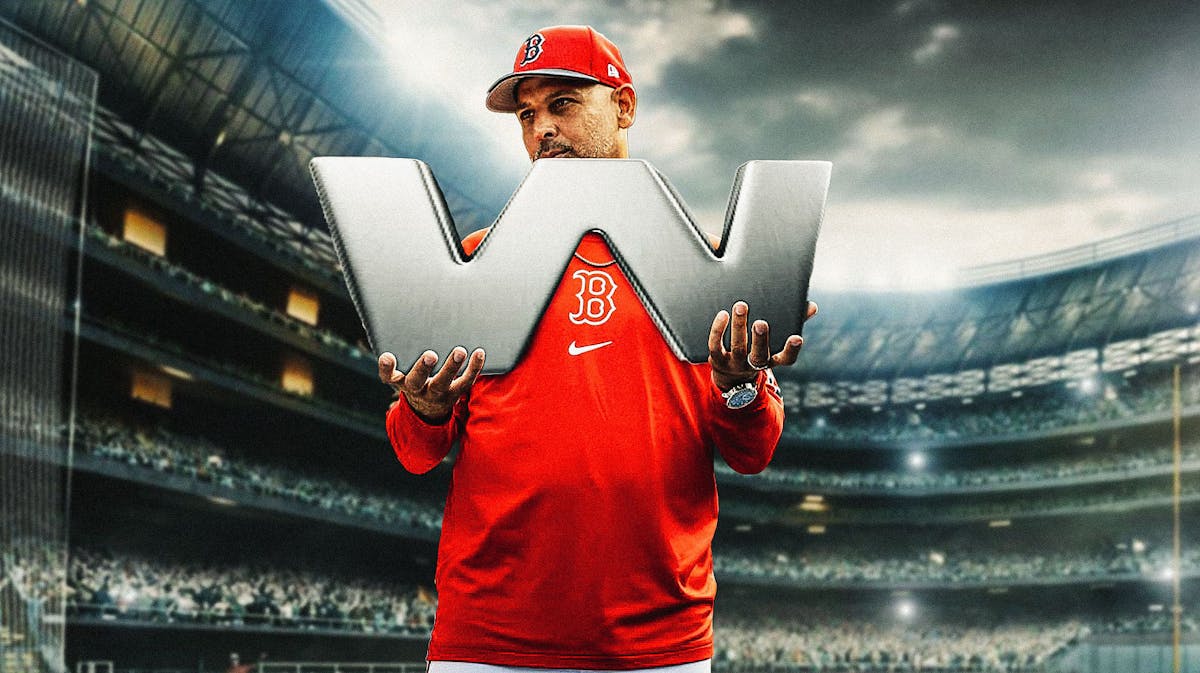 Red Sox's Alex Cora holding huge "W" letter