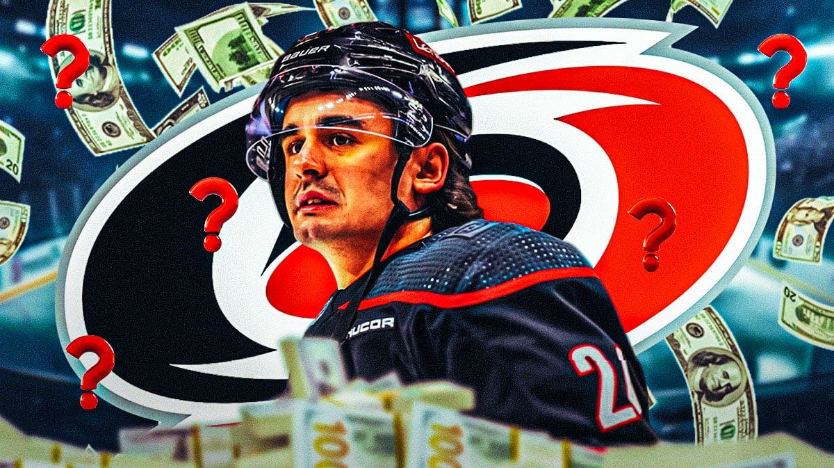 Seth Jarvis looking happy, money in image, 3-5 question marks, Carolina Hurricanes logo, hockey rink in background
