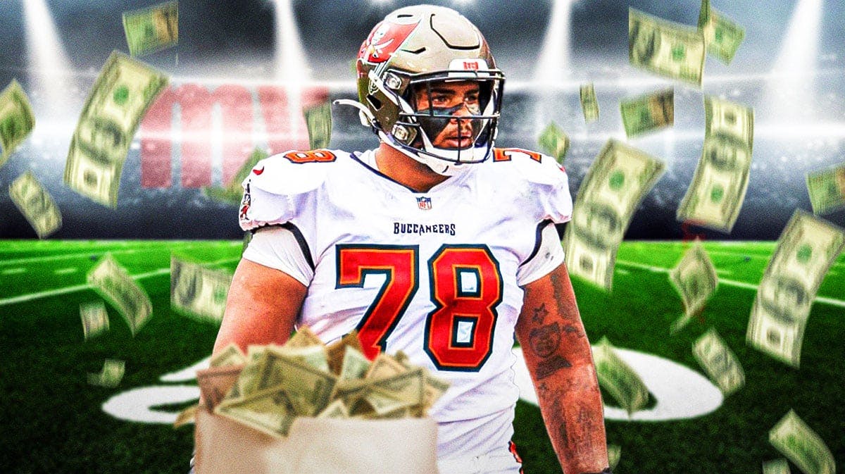 Tristan Wirfs with a bunch of money falling around him